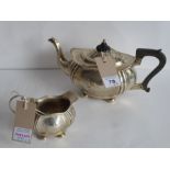 Being sold on behalf of Sue Ryder Care, hallmarked silver teapot and matching cream jug each of