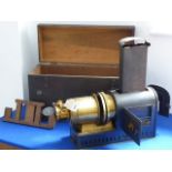 A 19th century stained-pine-cased gilt-metal-mounted magic lantern by Optimus (London); fully