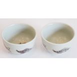 An interesting pair of Ming Dynasty underglaze copper red-decorated circular tea bowls; each