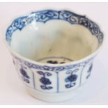 A delicately potted Chinese porcelain wine cup, the flower-head shaped top above an interior