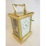 A large brass-cased striking carriage clock