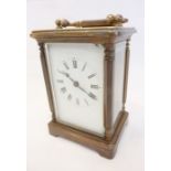 A brass-cased French carriage clock