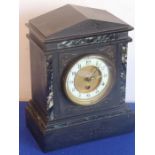 A late 19th century black-marble eight-day mantel clock, the cream chapter ring with Arabic numerals