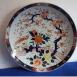 A large late 19th century Japanese porcelain circular charger, cobalt-blue border decorated with