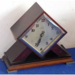 A striking Art Deco period  and design Bakelite mantel clock of lozenge form, the silvered dial with