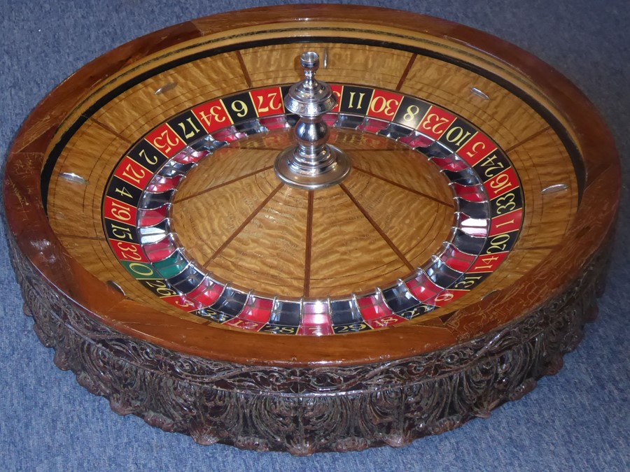 A rare and large late 19th/early 20th century American saloon roulette wheel marked for THE GEO.
