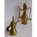 Two Middle Eastern Dallah brass coffee pots, 19th/20th century, one of typical form with beak