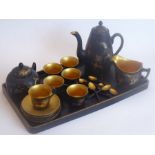 A Chinese mid-20th century papier-mâché six-place setting coffee service comprising tray, coffee