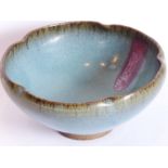 A Jun ware purple splash bowl (Yuan or early Ming), the lobed rim above a single vertical trail,