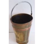 An early 20th century Arts and Crafts miniature brass and copper coopered pail with small individual