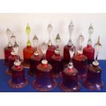 An assortment of 13 Cranberry glass bells (probably 19th century), some with clappers, some without,