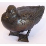 A heavy and darkly patinated well modelled Japanese bronze sculpture of a teal, 10cm long
