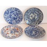 Three Chinese porcelain Kraak dishes decorated in underglaze blue in typical style, together with