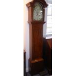 An early 19th century mahogany-cased eight-day longcase clock, the 12" broken-arched painted dial