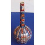 A late 19th century Japanese porcelain bottle vase hand decorated in the Imari palette, 32cm high