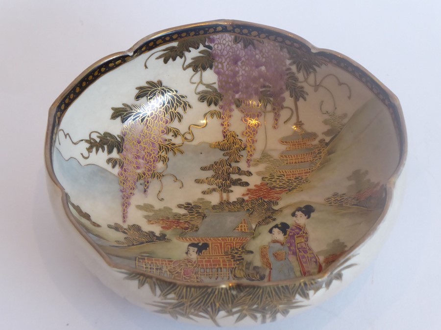 A Japanese Satsuma lotus-shaped pottery dish; very finely gilded and decorated with figures