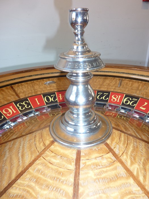 A rare and large late 19th/early 20th century American saloon roulette wheel marked for THE GEO. - Image 4 of 13