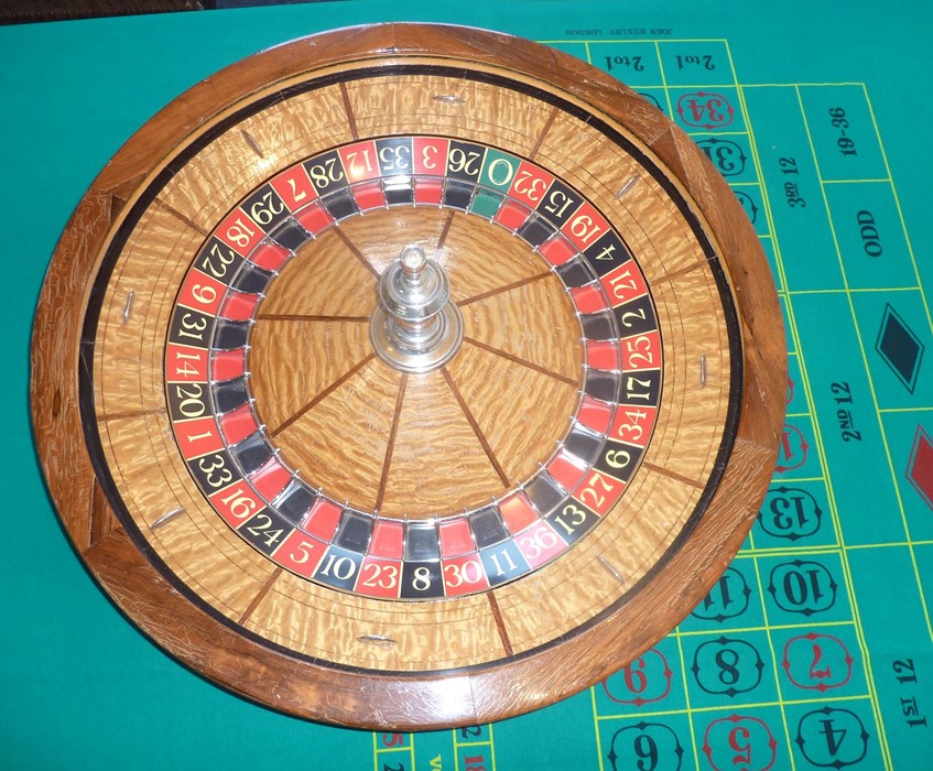 A rare and large late 19th/early 20th century American saloon roulette wheel marked for THE GEO. - Image 7 of 13