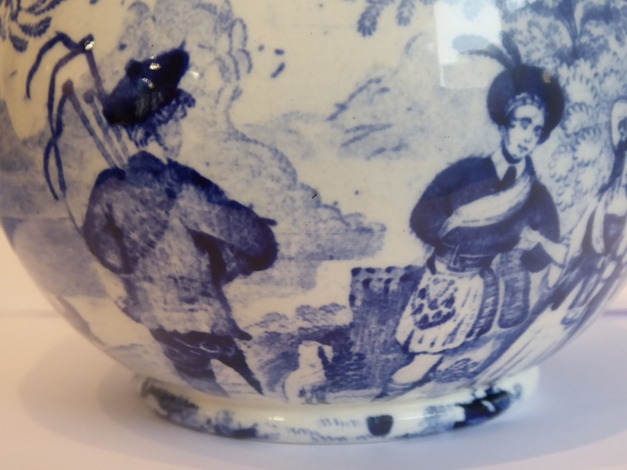 An early 19th century pottery bowl, blue transfer-decorated with figures outside a country - Image 2 of 2