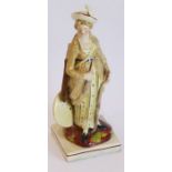 An unusual early 19th century pearlware figure of a lady archer with bow, arrows, quiver and