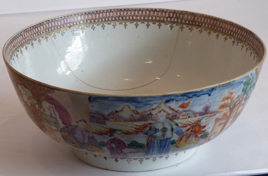 A Chinese porcelain export punch bowl hand-gilded and decorated in famille-rose enamels with figures