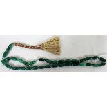 A green jade type prayer necklace, 41cm long to include the tassel