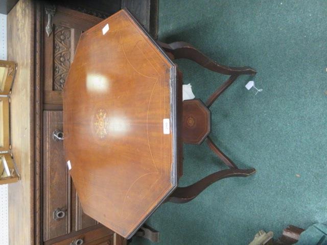 Octagonal occasional table, with under tier, the top with crossbanded inlay and floral decoration to