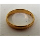 A 22ct gold band ring with faded hallmarks, ring size P, weight 3.2g