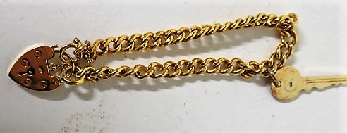 A marked 9ct gold heart padlock curb bracelet, with a marked 9ct gold key attached, weight 22g