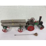 Mamod Steam Road roller together with logs and a log ca
