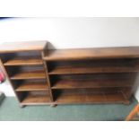 A stepped oak open front bookcase on bun feet