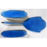 Three piece silver plate with blue enamel and guilloche dressing table set comprising a mirror and a