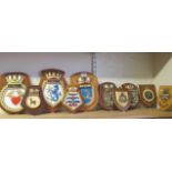 Nine ship crests of varying sizes together with a military crest (10)