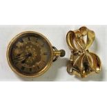A yellow metal open faced pocket watch with the inner cased marked 18 and .75, the outer case