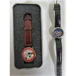 A cased Wallace and Gromit wristwatch together with a Disney World Mickey, Donald and Goofy