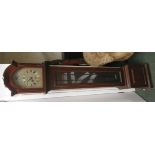 Grandmother clock with silver dial, and chiming movement, the case stained as mahogany