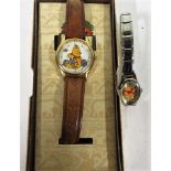 A cased Disney animal kingdom Winnie the Pooh watch, together with another Disney Winnie the Pooh