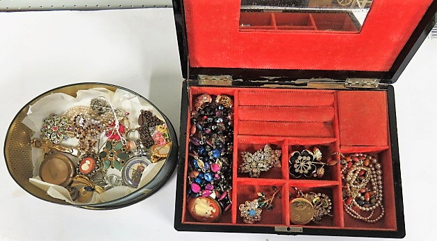 A large wooden jewellery box with mother of pearl inlay, together with another box, both