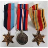 Three World War II medals to include the Africa Star, a World War II star, and a War medal