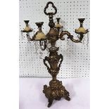 Gilt metal four branch candelabra, converted to electricity, 51cm high