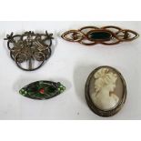 Four early 20th century brooches to include a green guilloche enamel silver brooch, marked 930s,