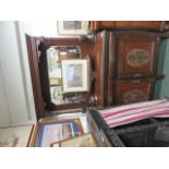 Red walnut sideboard with mirrored backs, the base with two drawers above two cupboard doors