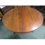 Mahogany circular dining table, with extra leaf