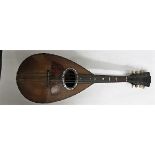 A uncased rosewood bowl backed six string mandolin with tortoiseshell decoration,