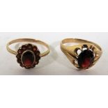 A marked 9ct gold dress ring set with dark red faceted oval stone, ring size S 1/2, weight 2.8g,