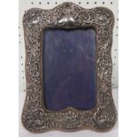 Silver embossed photograph frame, measuring 20cm x 14cm