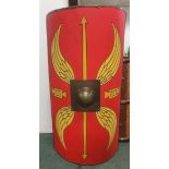 A full size reproduction Roman Shield, made of wood with metal boss and leather sling