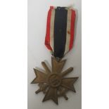 A War Merit Cross Second Class with swords, no makers mark, complete with ribbon Condition: In