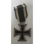 A World War I Second Class Iron Cross, complete with ribbon Condition: In good clean order