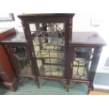 A late victorian ornate wood scroll glass fronted display cabinet, the middle section higher and